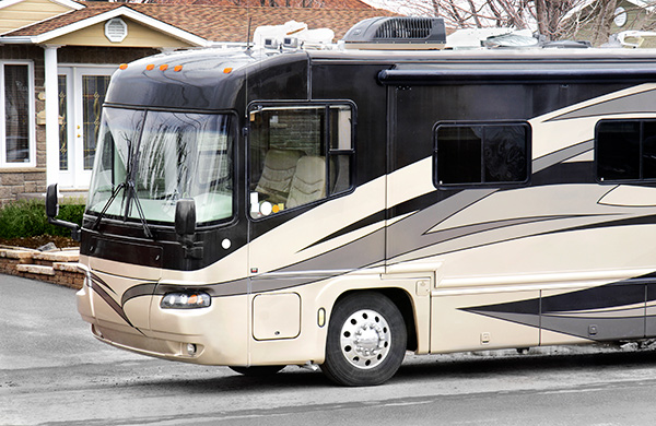 A large recreational vehicle on the road.