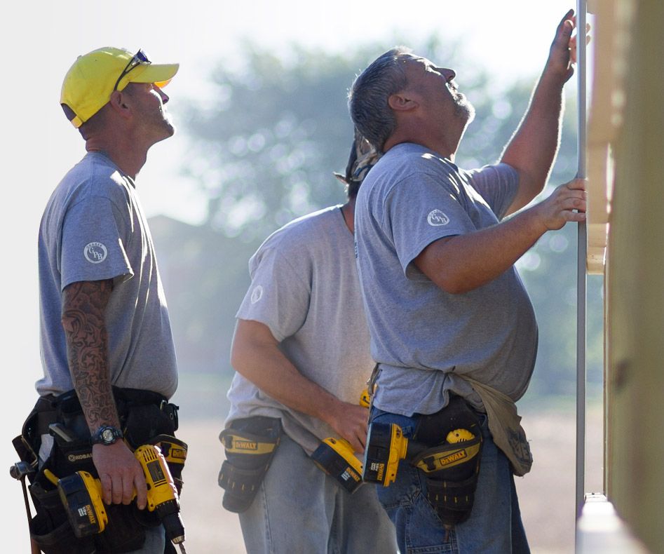 three DIY Pole Barns builders assembling a pole barn