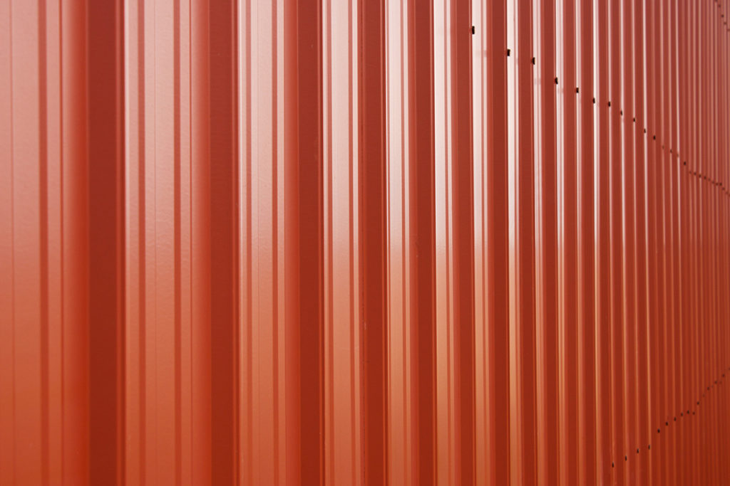 Red pole barn metal siding closeup