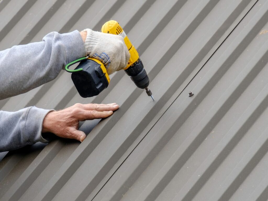 A pole barn builder using ZXL screws on metal roofing