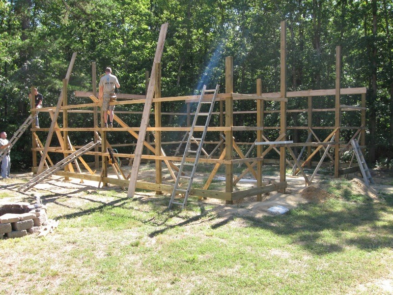A pole barn framing in progress from DIY Pole Barns