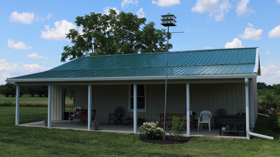 A DIY Pole barn featuring a pole barn porch